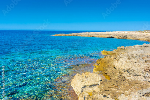 Amazing crystal clear water in the beach of Porto Selvaggio Natural Reserve in Salento, Apulia Italy photo