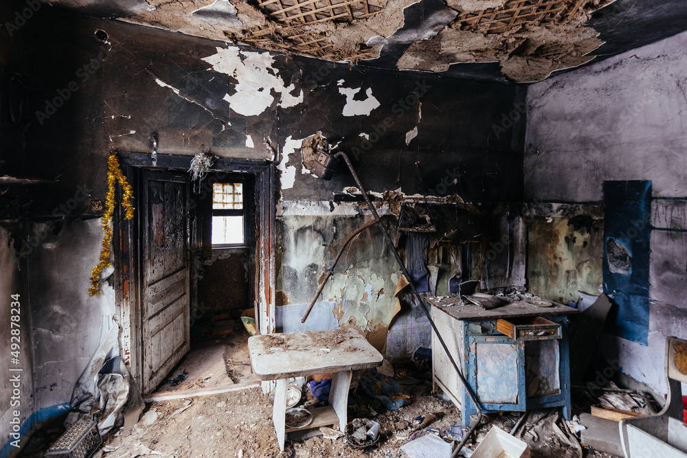 Burnt house interior. Consequences of fire or war