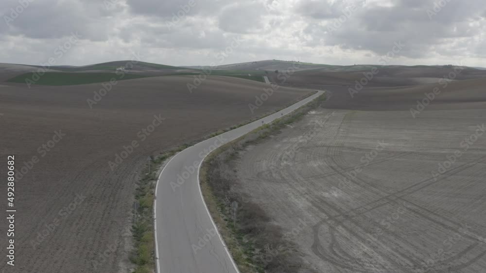 Drone shot of tracks on the fields of dirt and grass in south of Spain, Andalucia Drone shot of tracks on the fields of dirt and grass in south of Spain, Andalucia