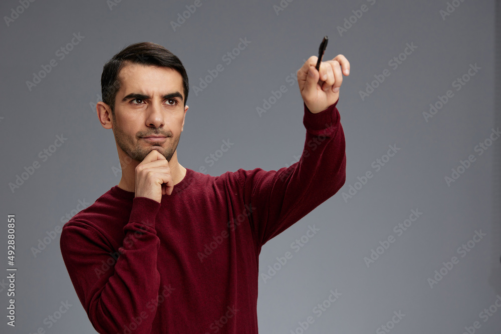 successful man posing with pen gesture hands red sweater business and office concept successful man posing with pen gesture hands red sweater business and office concept