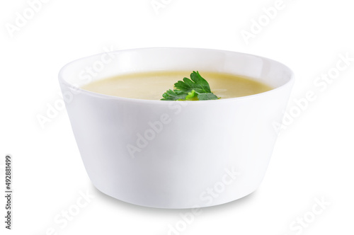 Potato cauliflower puree soup in a bowl on a white isolated background