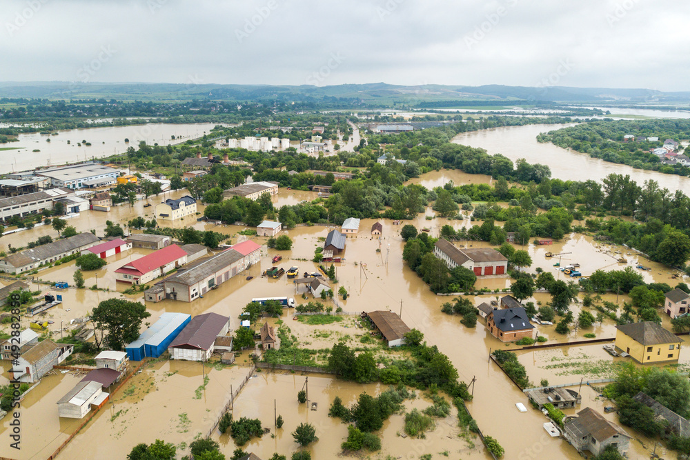 Aerial view of flooded houses with dirty water of Dnister river in Halych town, western Ukraine