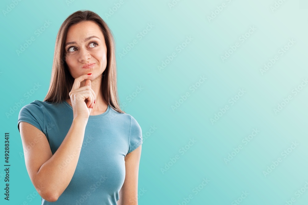 Young happy teen woman thinking something Young happy teen woman thinking something