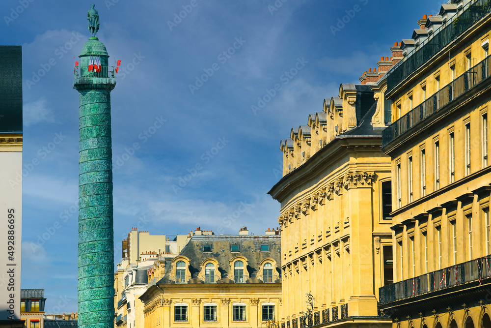 Obraz premium The landmark green column in the center of the Place Vendome square in&nbsp;Paris, France