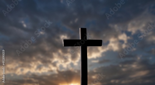 The wooden Cross at the sunset sky background