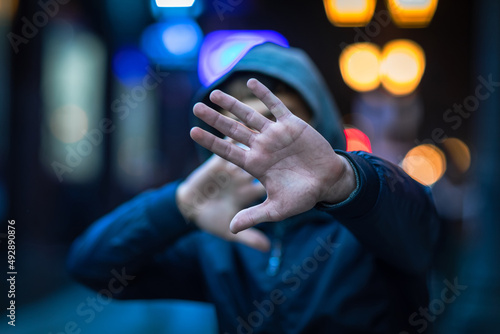 man hand stop sign in face