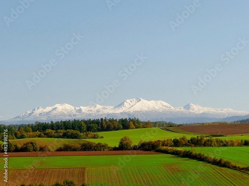 snow mountain with grass hills in Hokkaido © d17529