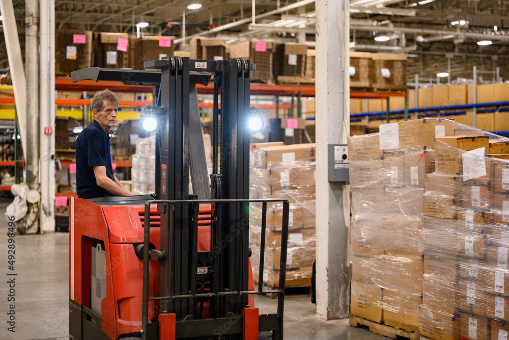 Loading dock driver moving goods at warehouse Loading dock driver moving goods at warehouse
