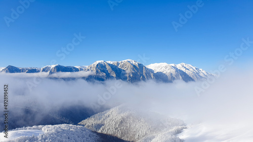 snow covered mountains  Bucegi Mountains  viewpoint from Baiului Mountains  Romania 