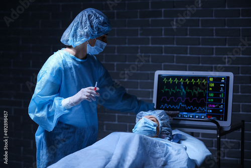 Surgeon operating patient i...