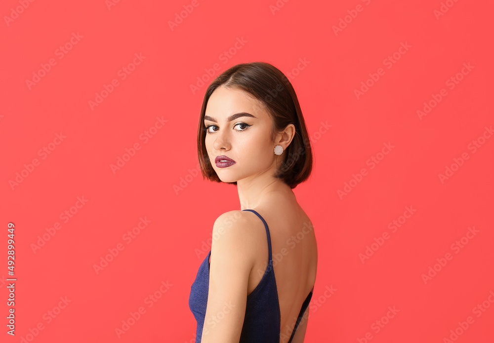 Beautiful young woman with dark lipstick and stylish jewelry on color background Beautiful young woman with dark lipstick and stylish jewelry on color background