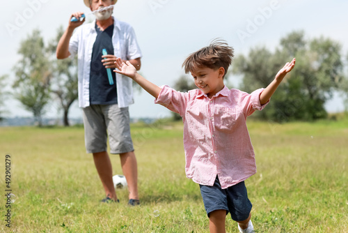 Little boy and his grandfat...