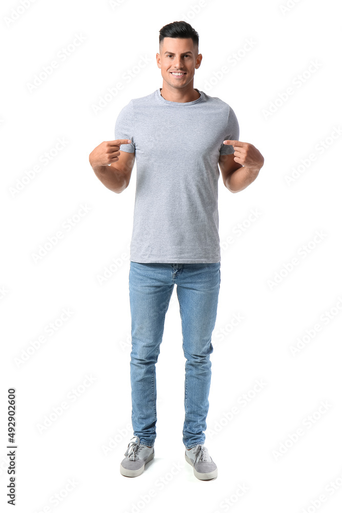 Naklejka premium Handsome young man in stylish t-shirt isolated on white