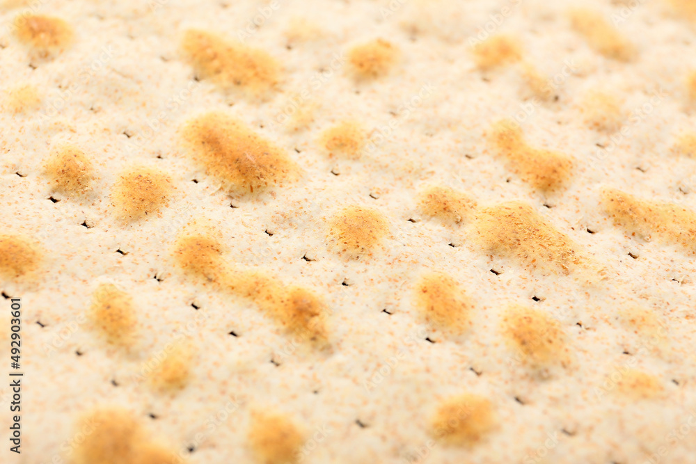 Traditional Jewish flatbread matza for Passover as background, closeup Traditional Jewish flatbread matza for Passover as background, closeup