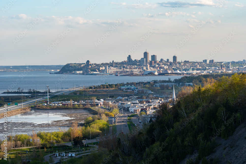 The St Lawrence river and the city of Quebec, it's old district and its harbor with the beauport district in the foreground, view since the Montmorency falls national park of the SEPAQ