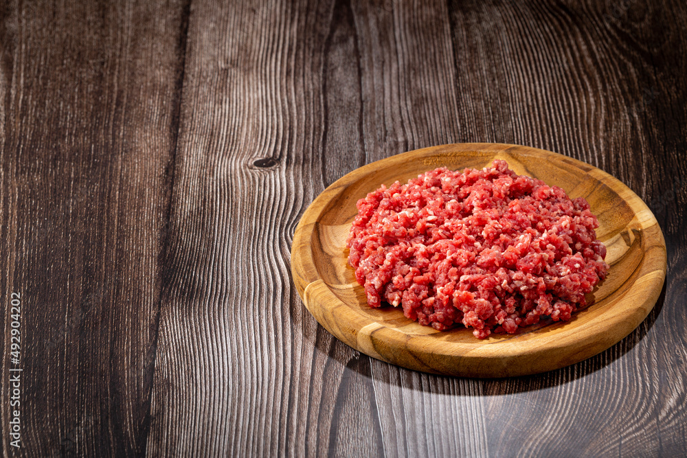 Raw ground beef ready for preparation. Raw ground beef ready for preparation.