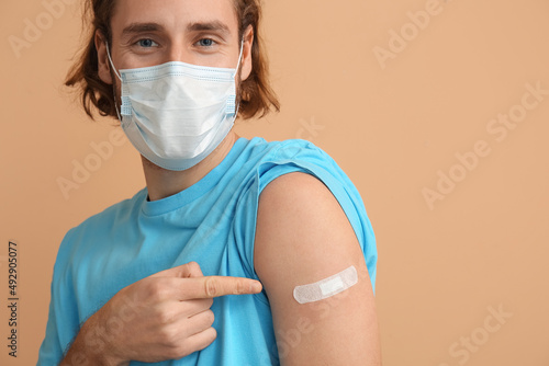 Young man in medical mask a...