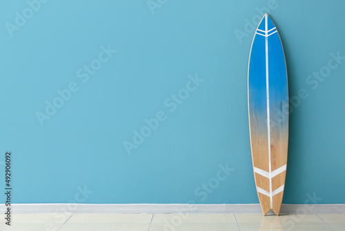 Modern surfboard near color...