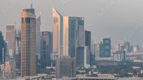 Dubai Downtown at sunset timelapse. Aerial view over big futuristic city. photo