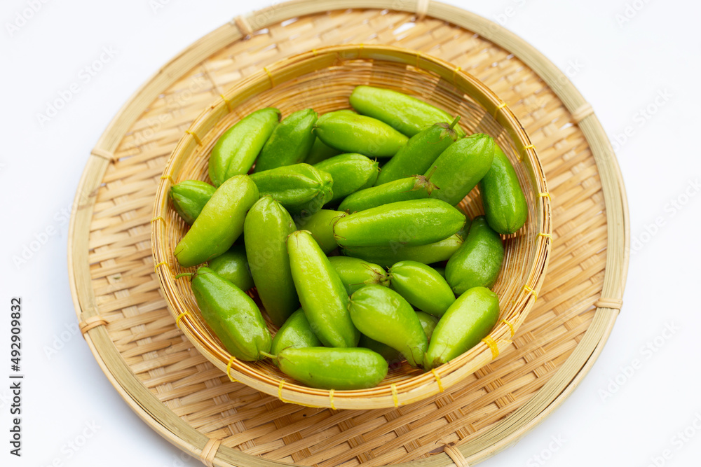 Bilimbi fruit in bamboo basket on white background. Bilimbi fruit in bamboo basket on white background.