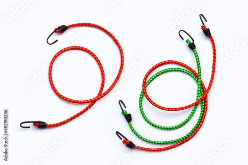 Braided elastic strap with hooks on white background. photo