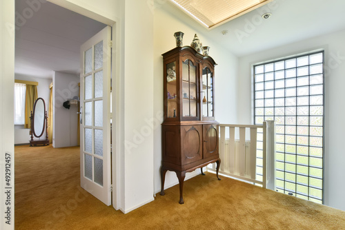 Compact modest Mini corridor with wooden furniture in an unusual style photo