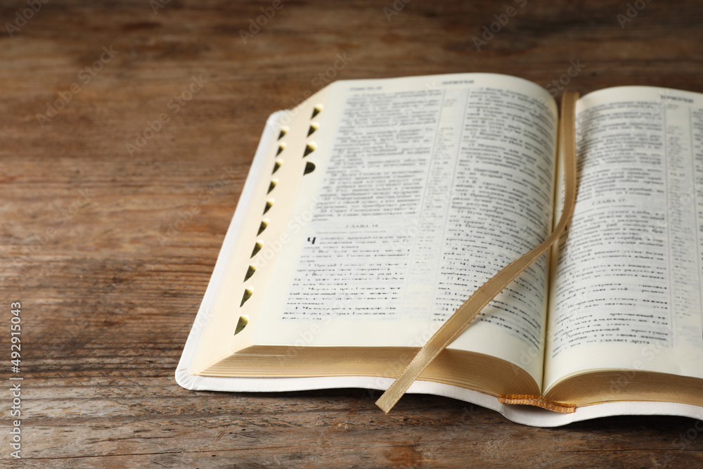 Open Bible on wooden table. Christian religious book Open Bible on wooden table. Christian religious book