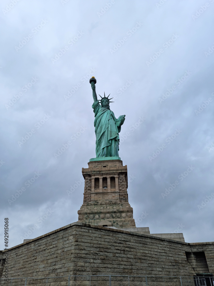 statue of liberty and cloudy day