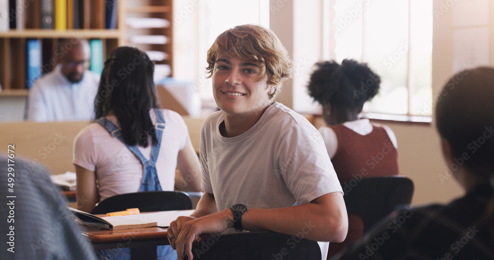 Life is one big lesson. Portrait of a teenage boy in a classroom at high school. Life is one big lesson. Portrait of a teenage boy in a classroom at high school.