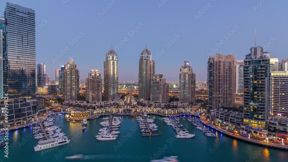 Dubai Marina skyscrapers aeral day to night timelapse, port with luxury yachts and marina promenade Dubai Marina skyscrapers aeral day to night timelapse, port with luxury yachts and marina promenade