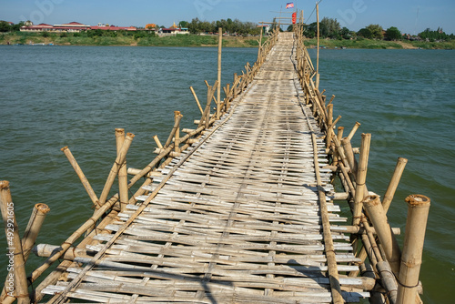 Bild auf Leinwand Kampong Cham, Cambodia - February 2022: The Kampong Cham bamboo bridge in Cambodia is the longest in the world on February 6, 2022 in Kampong Cham, Cambodia