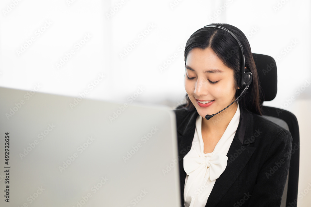 Call centre female operator. Smiling asian business woman receptionist wearing headphone video conference calling talk by webcam in online chat customer support service. Call centre female operator. Smiling asian business woman receptionist wearing headphone video conference calling talk by webcam in online chat customer support service.