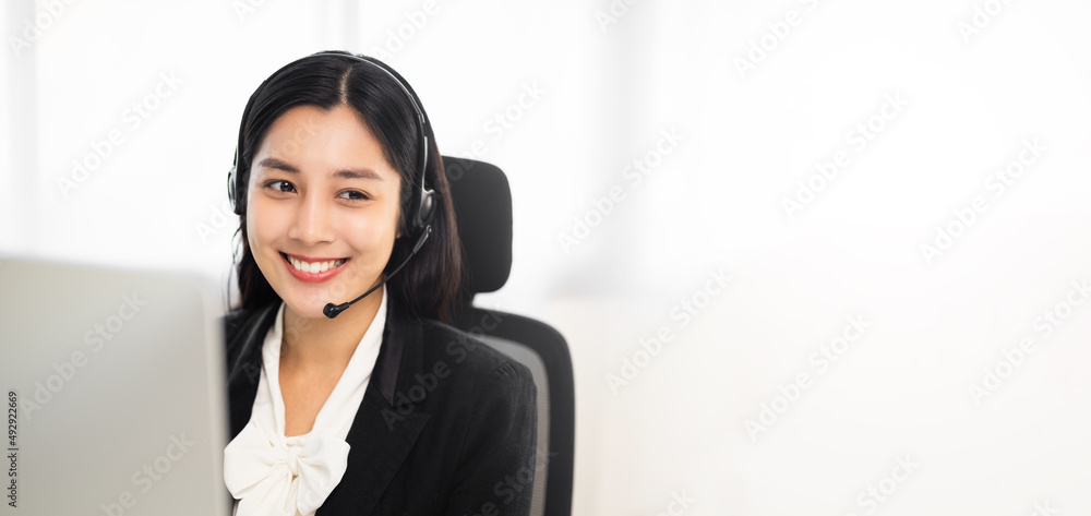 Call centre female operator. Smiling asian business woman receptionist wearing headphone video conference calling talk by webcam in online chat customer support service. Call centre female operator. Smiling asian business woman receptionist wearing headphone video conference calling talk by webcam in online chat customer support service.