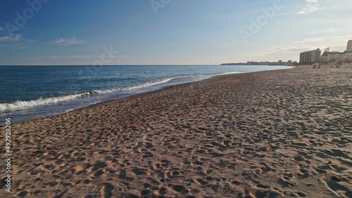 Walking along the beach of Benalmadena, Spain photo