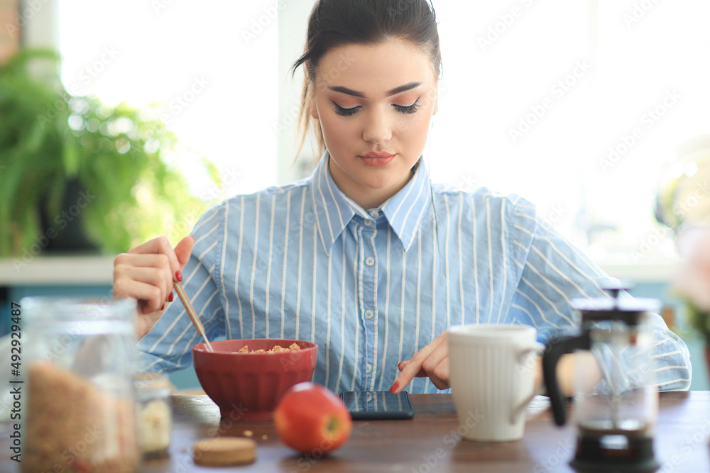 Young attractive woman making breakfast in morning. Young attractive woman making breakfast in morning.
