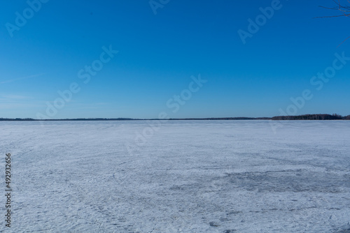 Fototapeta Naklejka Na Ścianę i Meble -  A frozen lake on a sunny day