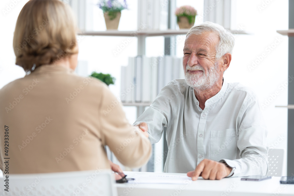 senior businessman shaking hands and congratulations for a new job senior businessman shaking hands and congratulations for a new job