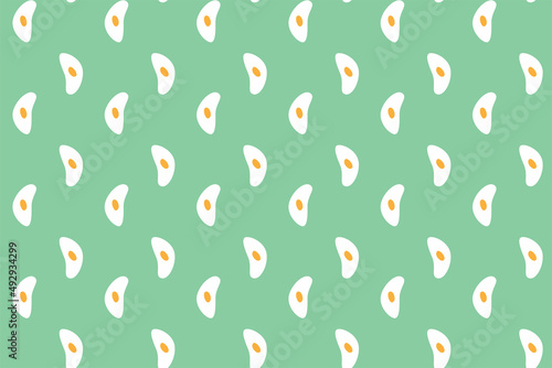 Pattern with scrambled eggs on a green background