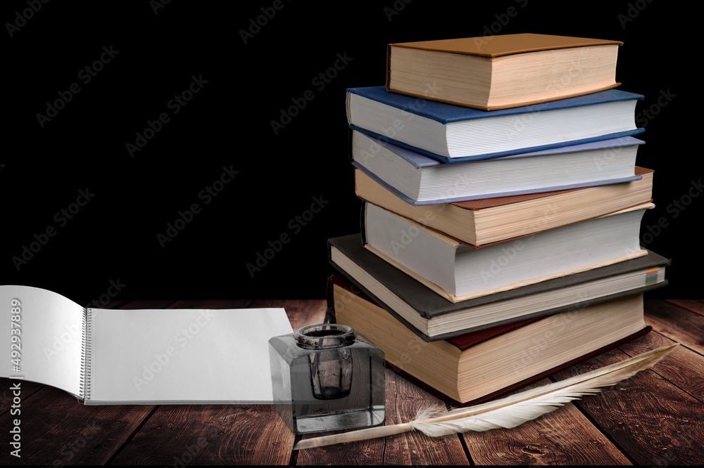 Biblical commandment, quill and stack of shabby old jewish books. Jewish prayer Shema Yisrael in hebrew to fulfill Biblical commandment, quill and stack of shabby old jewish books. Jewish prayer Shema Yisrael in hebrew to fulfill