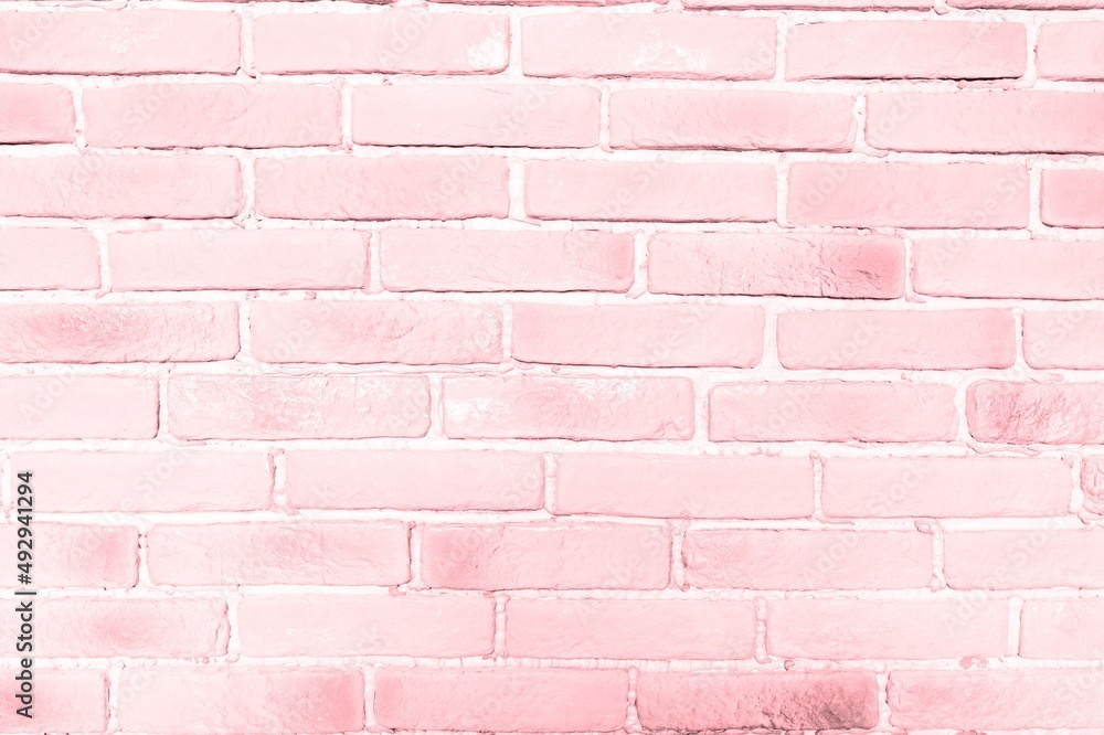 Obraz premium Brickwork stonework interior. Pink brick wall texture in the bedroom at lovely. Abstract weathered brick design