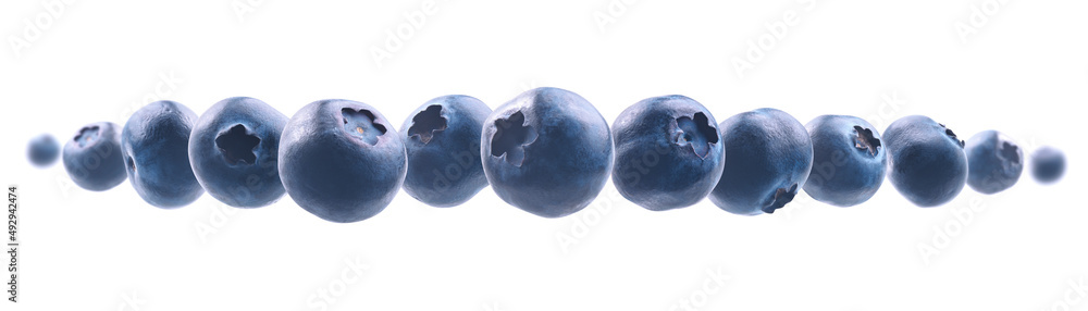 Ripe blueberries levitate on a white background Ripe blueberries levitate on a white background