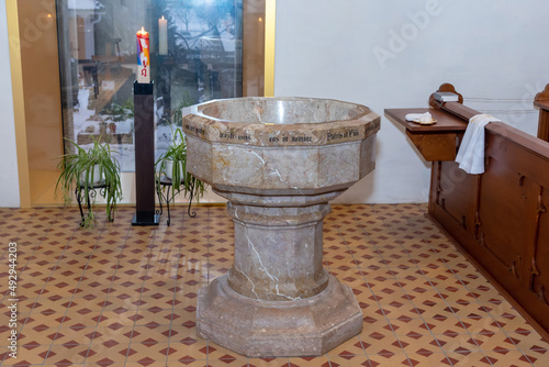 фотографія baptismal font made of stone