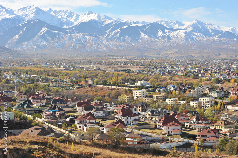 Almaty, Kazakhstan - 10.19.2012 : Residential buildings and commercial buildings located in the city center at the foot of the mountains.