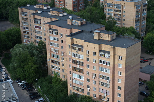 Shchelkovo / Russia - 06.20.2014 : Multi-storey buildings on the streets of the Moscow region. Dense development and Parking.