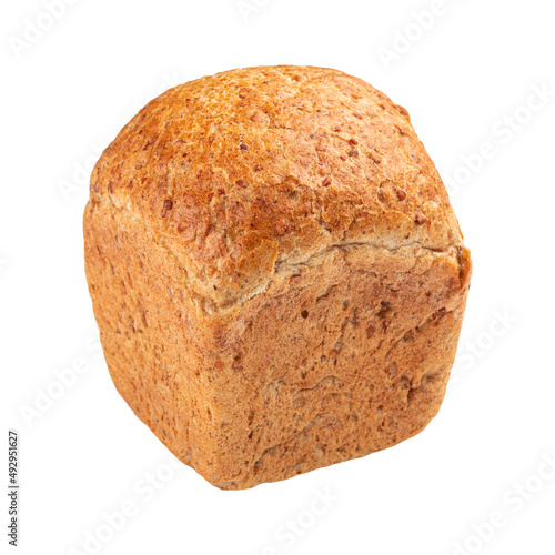 Isolated fresh baked loaf of buckwheat bread on a brown background