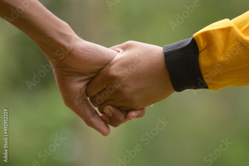 close up of people shaking hands