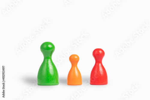 Fotografi small family, father, mother, child: colourful wooden play figures, white backg