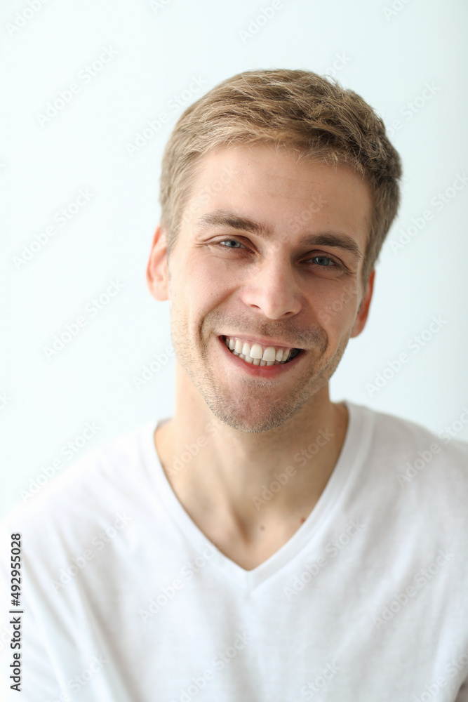 Young man checking his stubble in bathroom Young man checking his stubble in bathroom