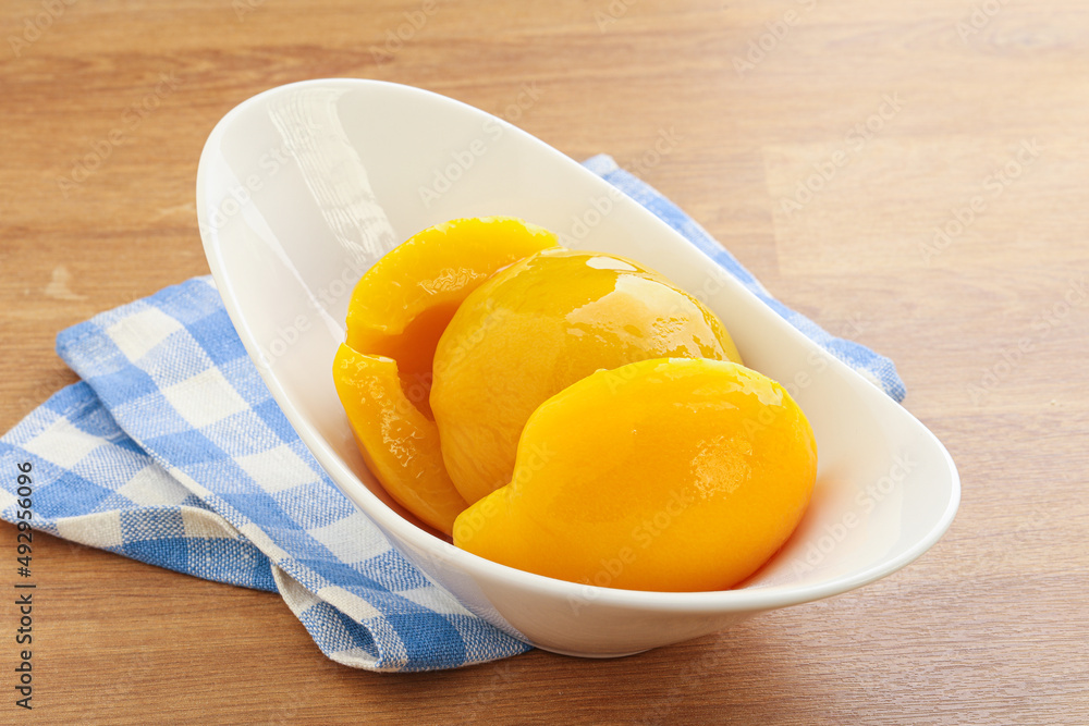 Sweet canned peaches with syrope Sweet canned peaches with syrope