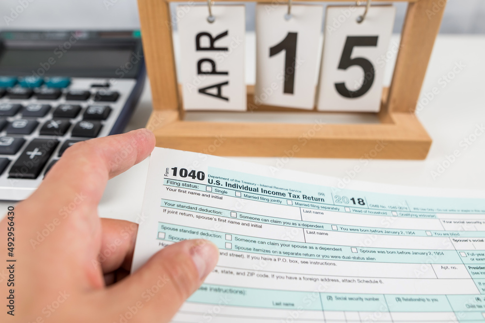 Obraz premium Tax return form 1040 on the table. financial document.